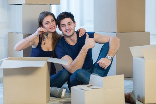 Removals team planning a home move on a residential street in Teddington