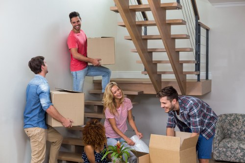 Packing boxes and furniture preparation for a house move in Teddington