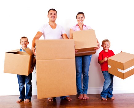 Unloading boxes and furniture into a new home during a Teddington relocation