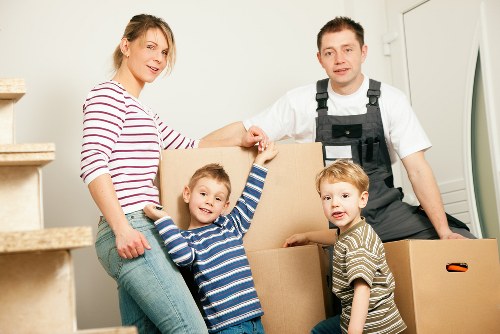 Removal van and moving boxes prepared for a home move in Teddington