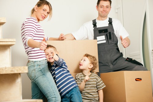 Furniture being carried carefully from a Teddington home